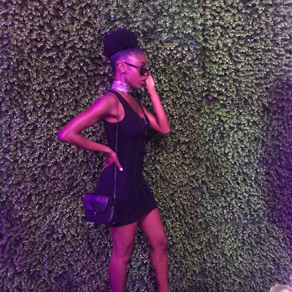 A form fitting little black dress